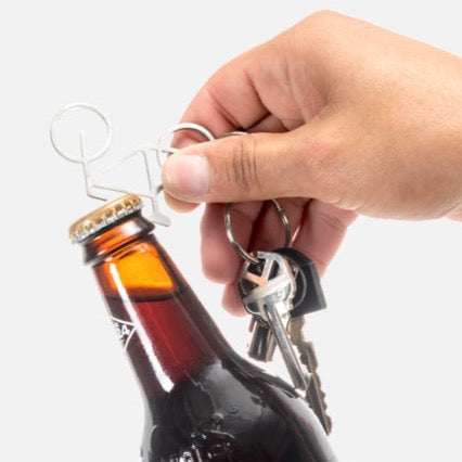 Porte clefs vélo ou peigne à barbe décapsuleur KIK