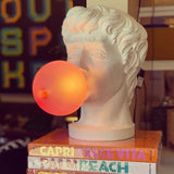 Lampe visage chewing-gum SEL